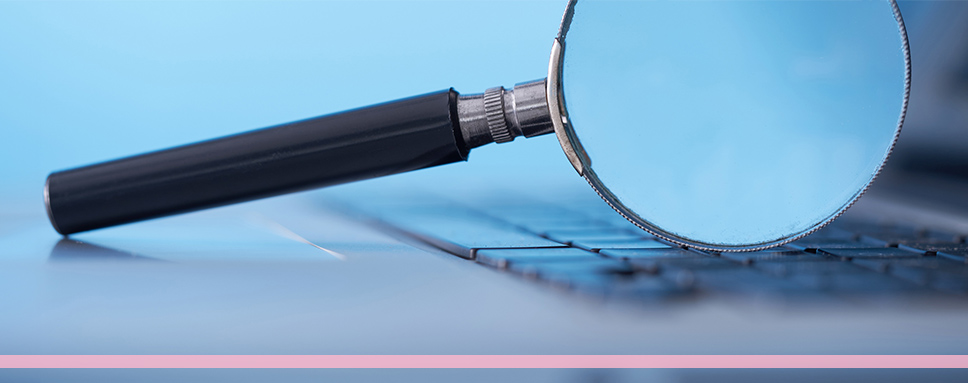 Förstoringsglas på dator.